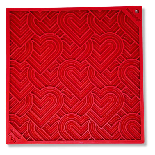 Red heart design enrichment lick mat for dogs.