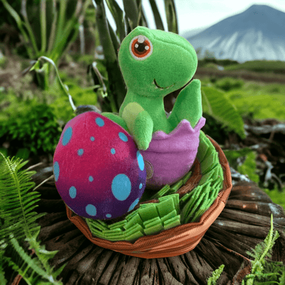 Two part plush dog toy resembling a baby dinosaur coming out of its egg shell and a nest that is made of snuffle material resting upon a trunk of a tree in rainforest setting.